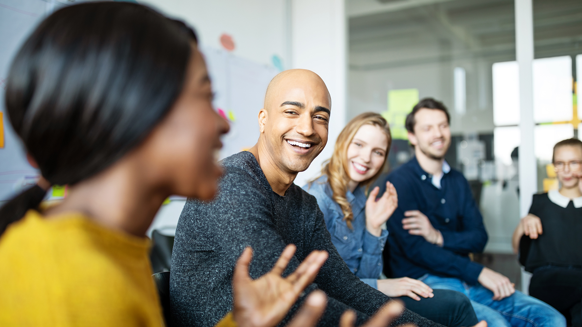 Work team meeting and laughing together
