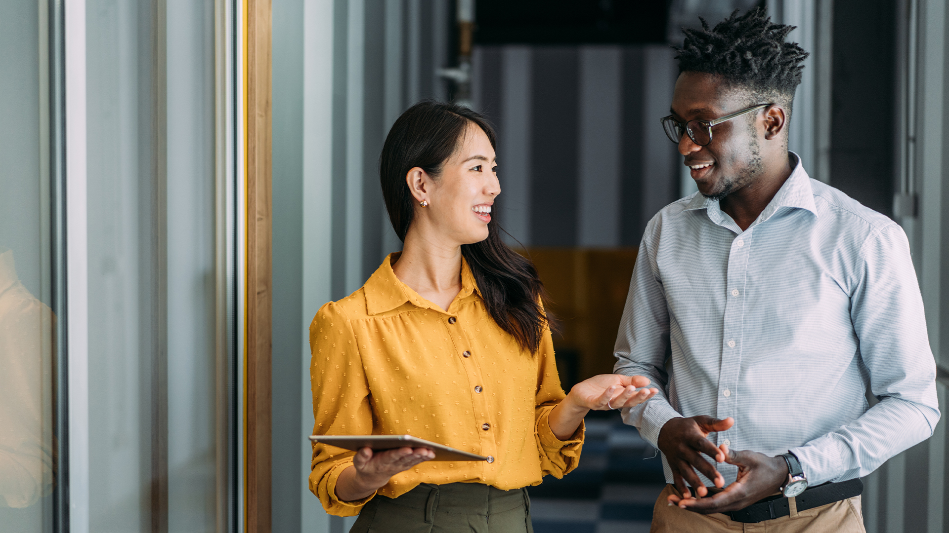 Female financial advisor speaking with her young client