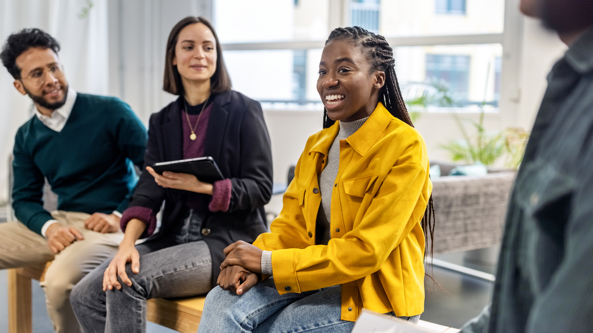 Diverse group of people talking in a group