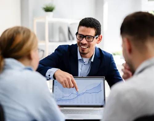 Man pointing at screen meeting with clients