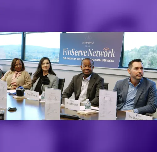 Panel of Finserve ambassadors sitting at a table