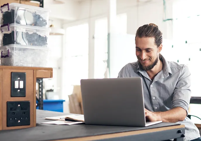 Man working on his laptop from home