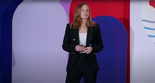 Fiona Greig speaking on stage