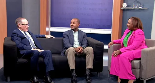 Terry Parham Jr, Terrell Dinkins, and Scott Winslow sitting and talking to each other
