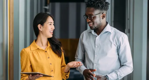 Female financial advisor speaking with her young client