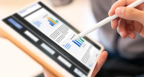 Man writing on his tablet with a stylus