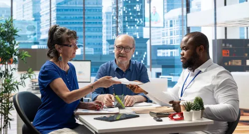 Advisor meeting with middle aged married couple